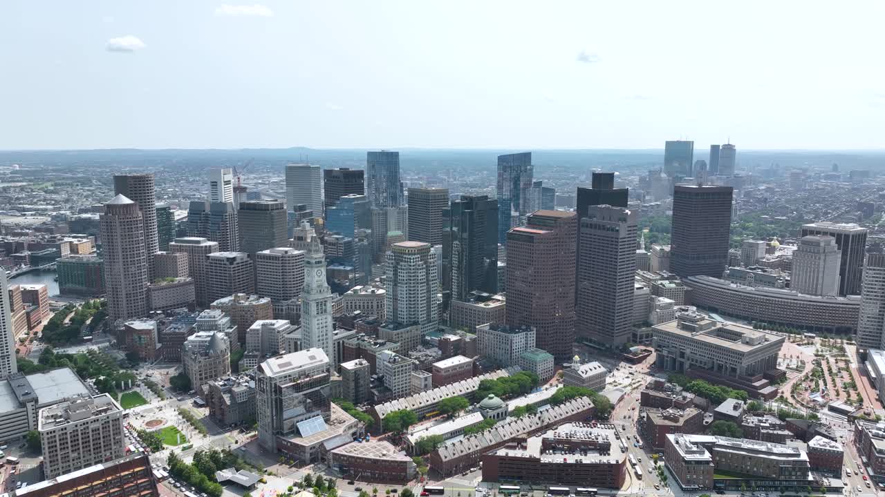 Wide drone shot of Boston's skyscraper skyline on a nice day