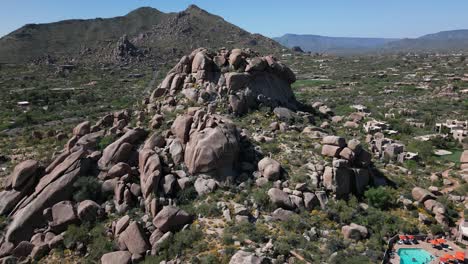 vast stone desert landscape in arizona, aerial orbit around rocky hill