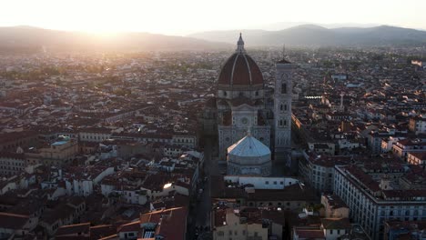 sunrise behind cathedral of santa maria del fiore, florence, italy