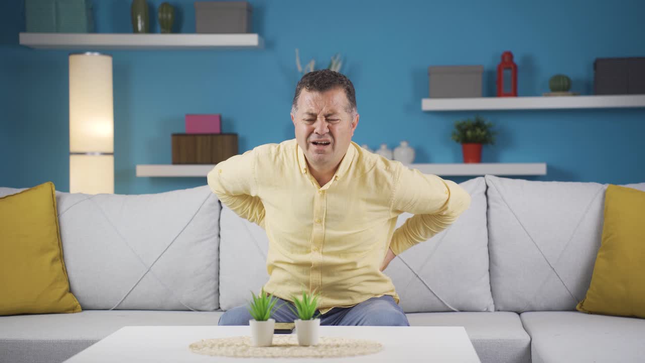 Man with low back pain with hernia.