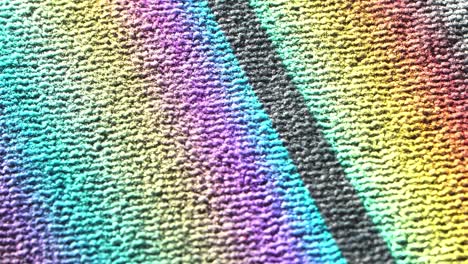 colorful light refraction on carpet, close-up view