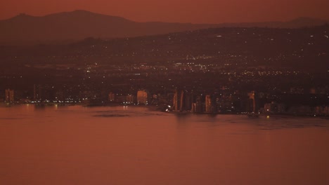 video of beautiful view of sunset over the town on the coast
