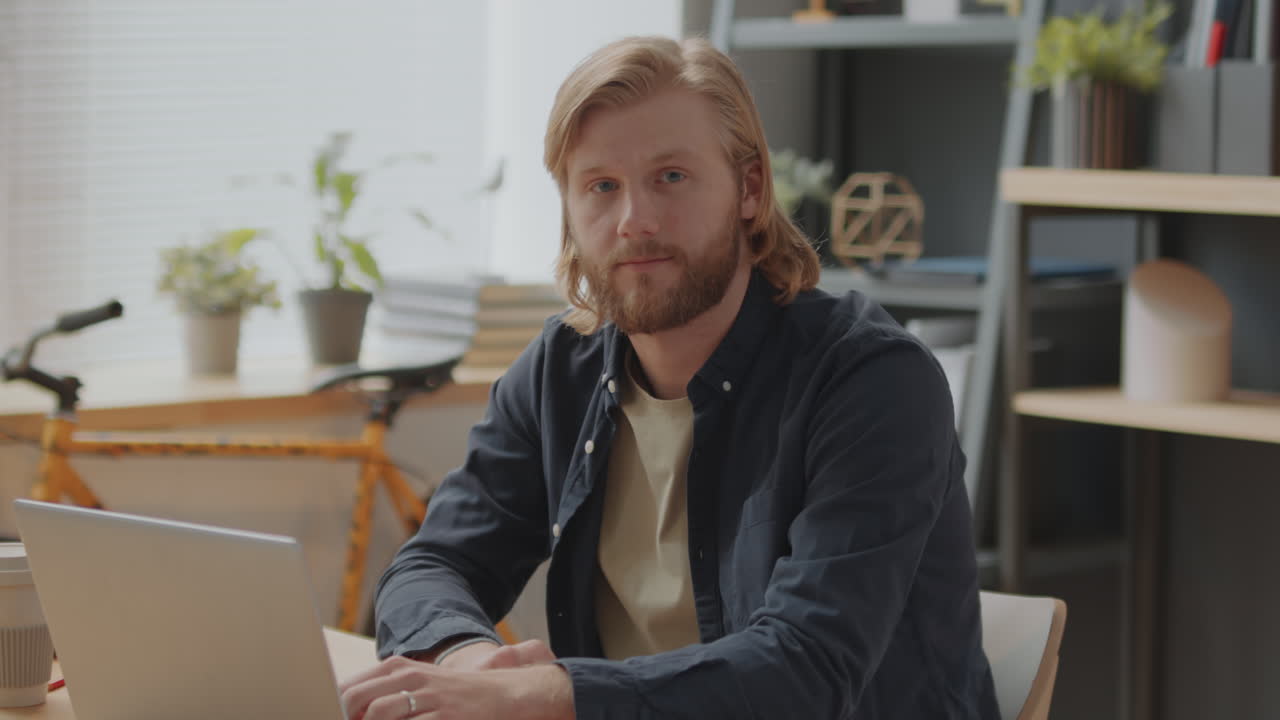Portrait of Young Man Working in Office