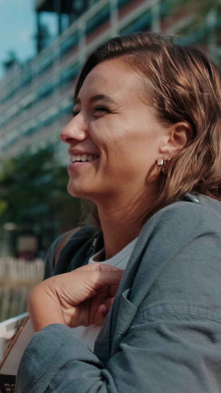 Close up girl student listens attentively to someone standing outside