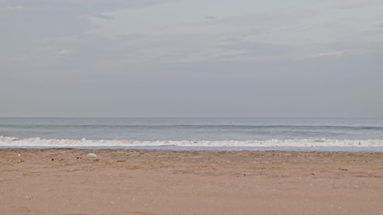 Indian person walking in gandhi beach or marina beach at Triplicane, Chennai, Tamil Nadu, india. sun set time, stable shot, 4k.