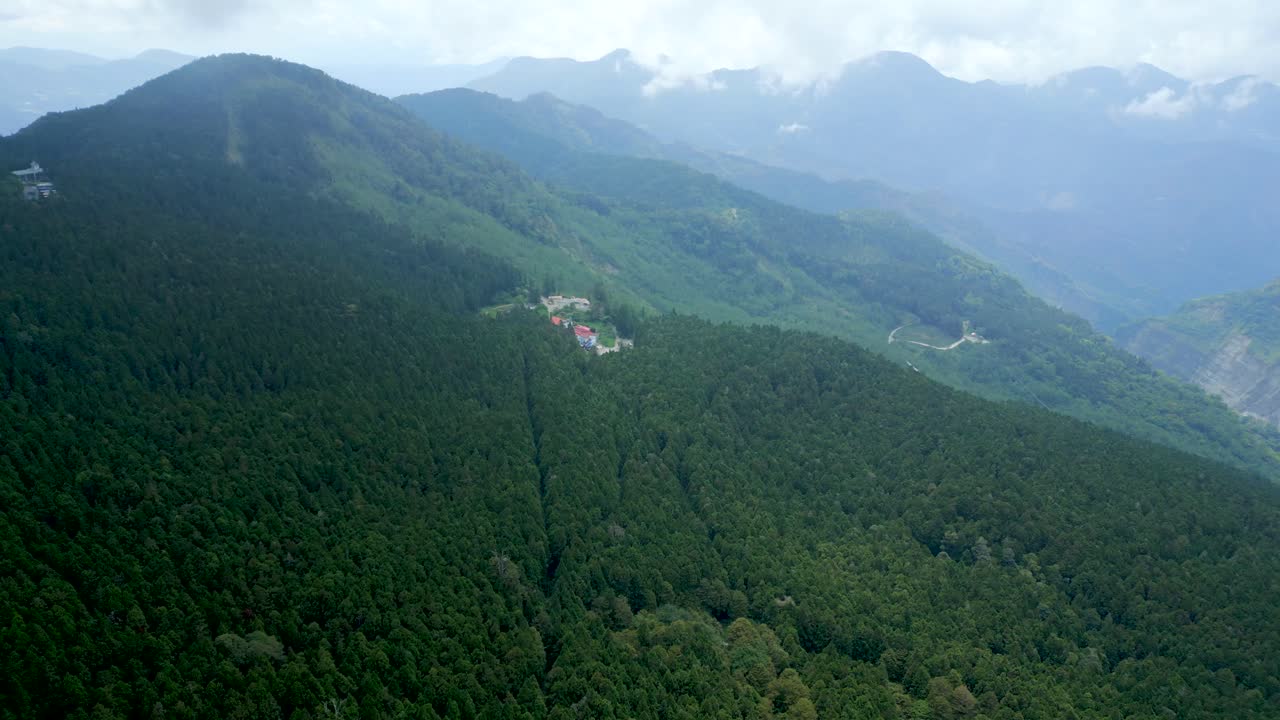 Aerial View Of Alishan National Forest Recreation Area On Forested Mountain Range In Fog. Chiayi County, Taiwan.