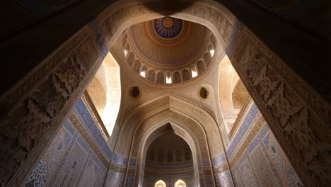 grand interior of a central asian mosque with ornate islamic art and calligraphy