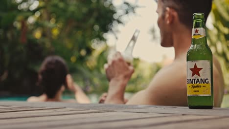 Couple-at-Canggu-and-Echo-Beach-enjoying-a-beer-at-the-poolside