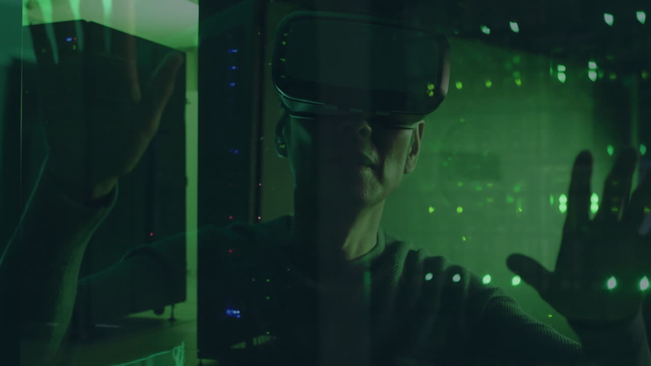 Wearing VR headset, person interacting with animation in green-lit room