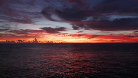 Glorious-Sunset-Scenery-By-The-Calm-Sea-Under-The-Picturesque-Sky-In-Fiji-Island---Golden-Hour---Drone-Shot