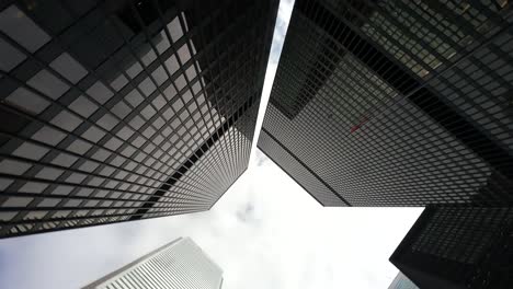 toronto skyscrapers from ground perspective against cloudy sky