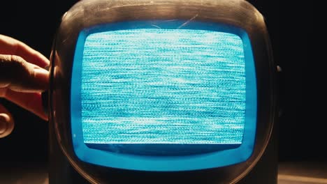 retro tv, vintage television in a nostalgic setup, a retro tv displays grain on screen, scary halloween night device good for chroma key and green screen. high quality 4k footage