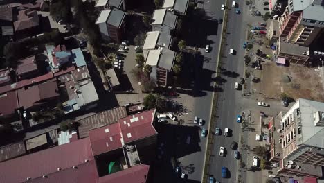 Road-traffic-aerial-reveal-of-metropolitan-cityscape-in-African-modern-city