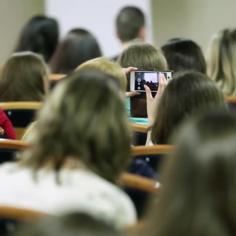 audience listening to presentation at conference