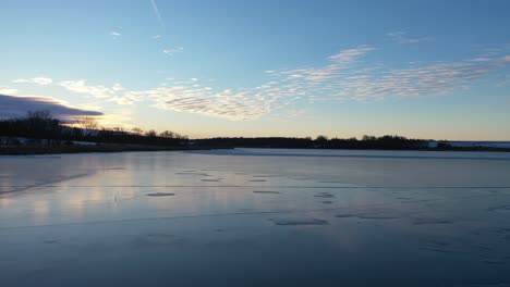 frozen lake at sunrise/sunset