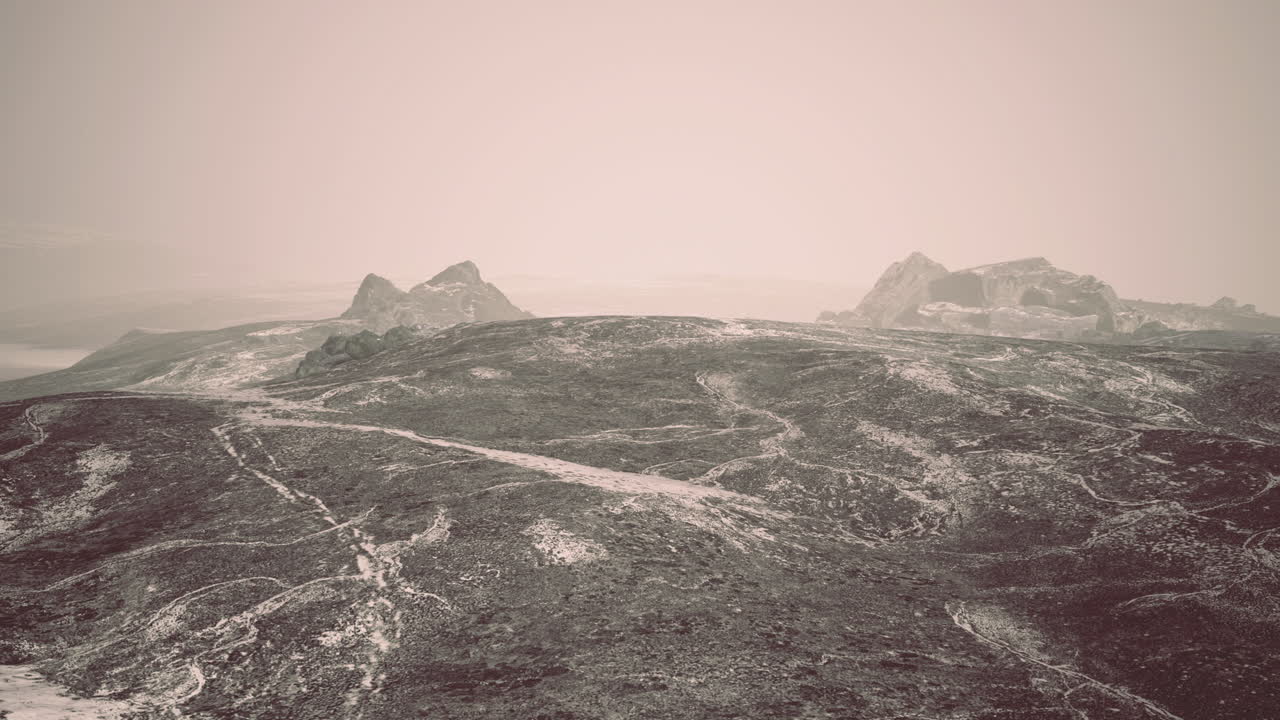 Winter landscape with rocky outcrops and mist in a remote area