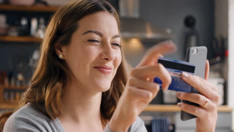 Credit-card,-excited-and-smartphone-of-woman