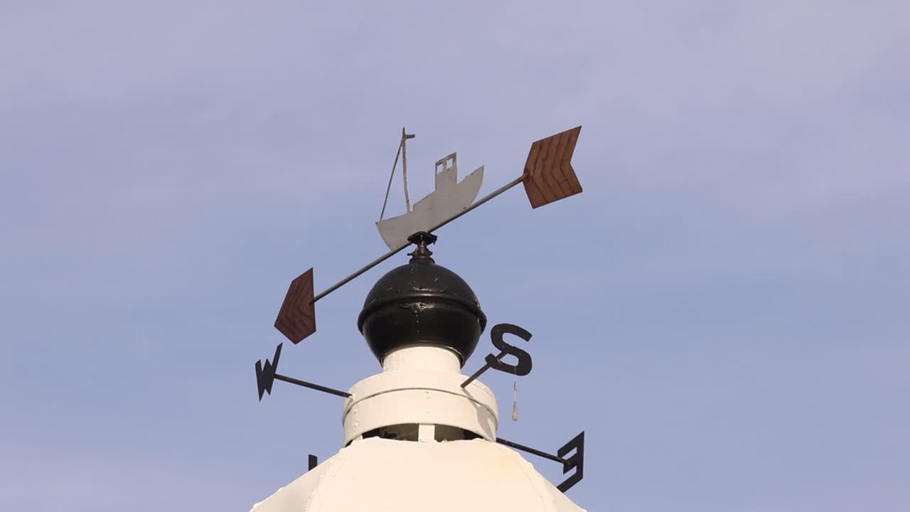 Weather Vane on top of harbour light. Port Erin. Isle of Man. UK