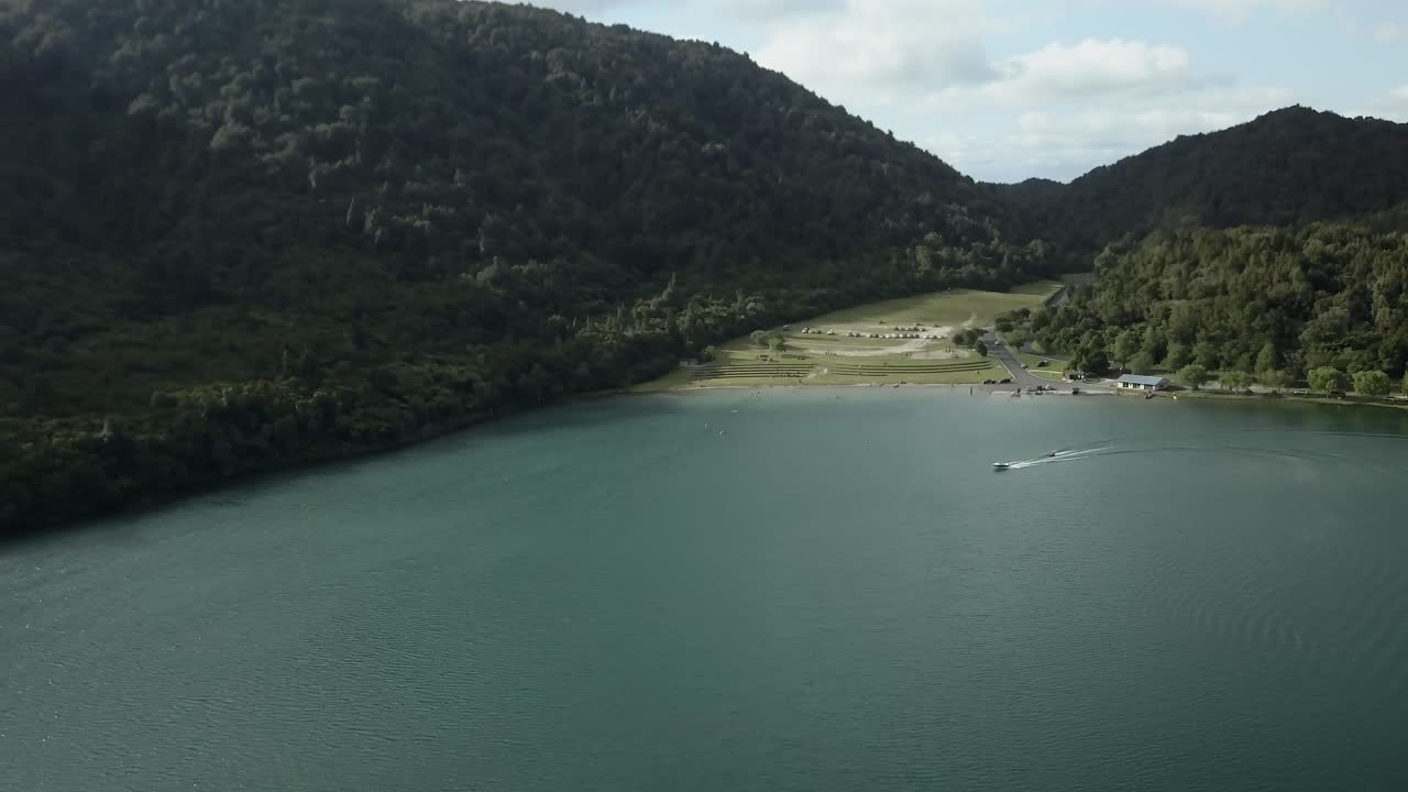 Scenic lake view with mountains and boat