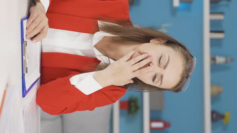 Vertical-video-of-Home-office-worker-woman-falling-asleep.