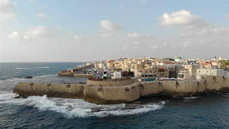 aerial footage over the old city of acre and the mediterranean sea