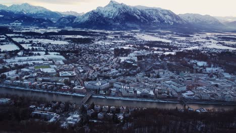 salzburg aerial view of old town with castle and river salzach, snow covered