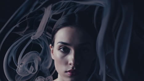 mysterious portraits of a woman with swirling smoke