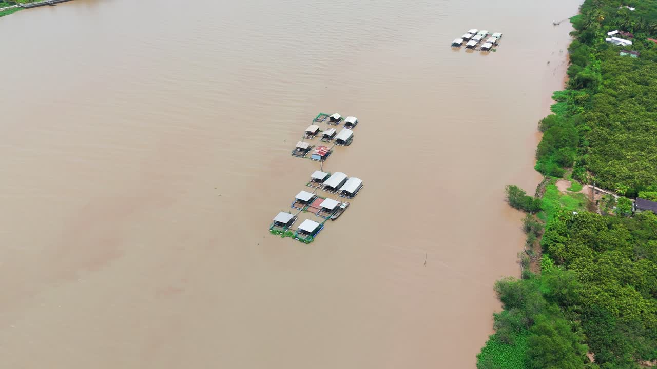 Aerial View - Circle Far - of Houses on the River in Ben Tre.