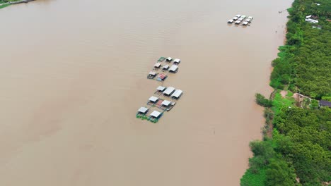 aerial view - circle far - of houses on the river in ben tre.