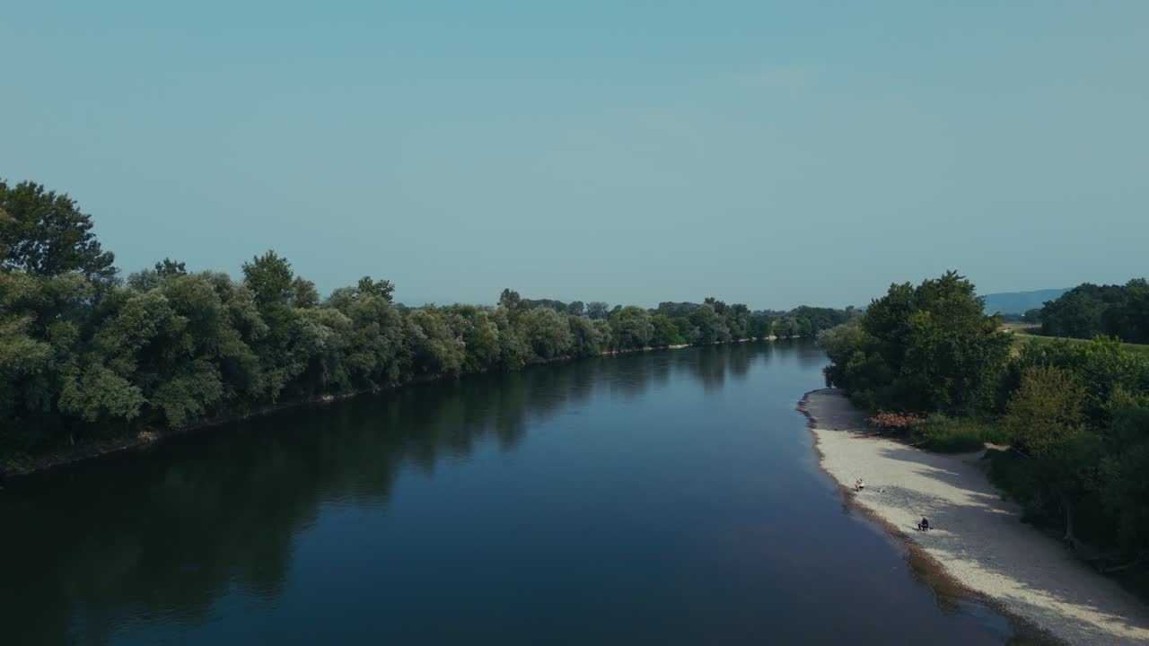 dense treeline and pale sand fringe the slow reflective bend of the Sava near Zagreb