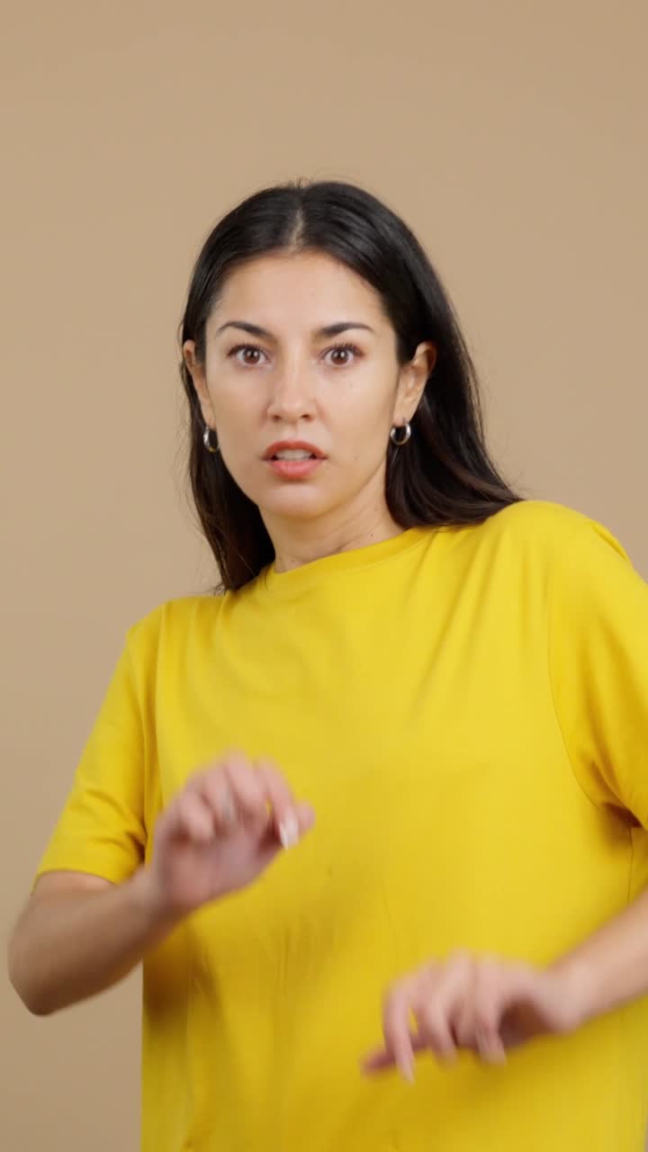 Woman expressing surprise and making a stop gesture