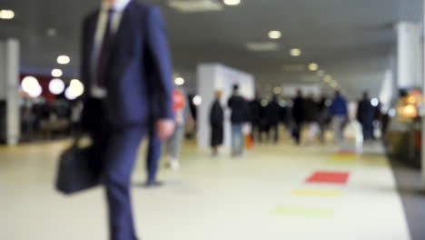 blurred people in a hallway