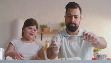 father and daughter baking together