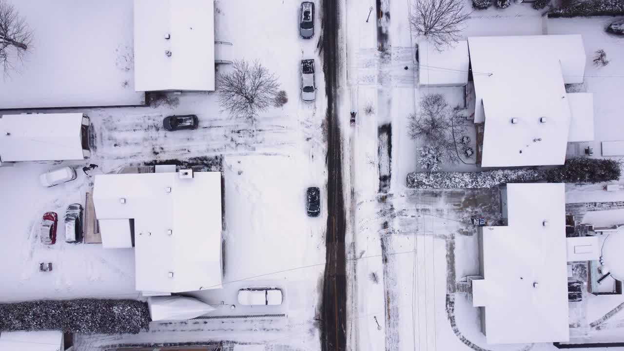Aerial Top-Down View of a Snow-Covered Residential Neighborhood after a snow storm