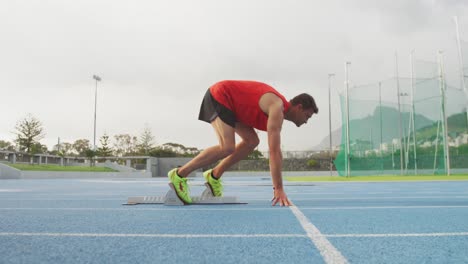 Caucasian-athlete-running-in-stadium