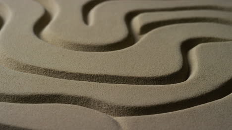 close-up of a winding sand maze pattern