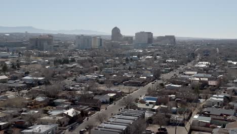 downtown albuquerque, new mexico with wide show drone video moving in a circle parallax