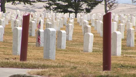 A-Detail-Of-Arlington-National-Cemetery-With-White-Headstones-And-Section-Markers