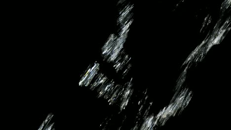 abstract shimmering light streaks on black