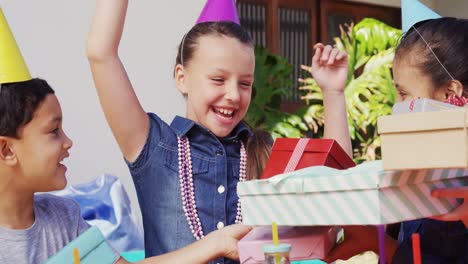 smiling girl receiving gifts from friends 4k