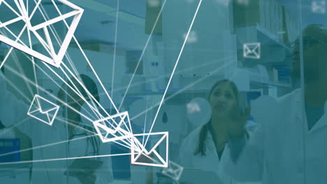 scientists using tablets in research lab, displaying glowing network lines and floating email icons