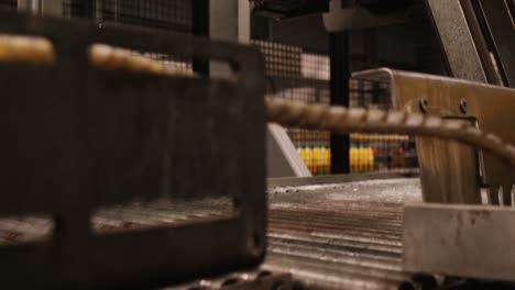 machine separating juice bottles