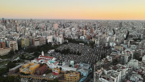 aerial establishing shot of la recoleta cemetery in downtown buenos aires at sunset