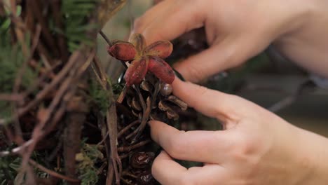 florist at work. how to make christmas wreath with floral arrangement. step by step, tutorial