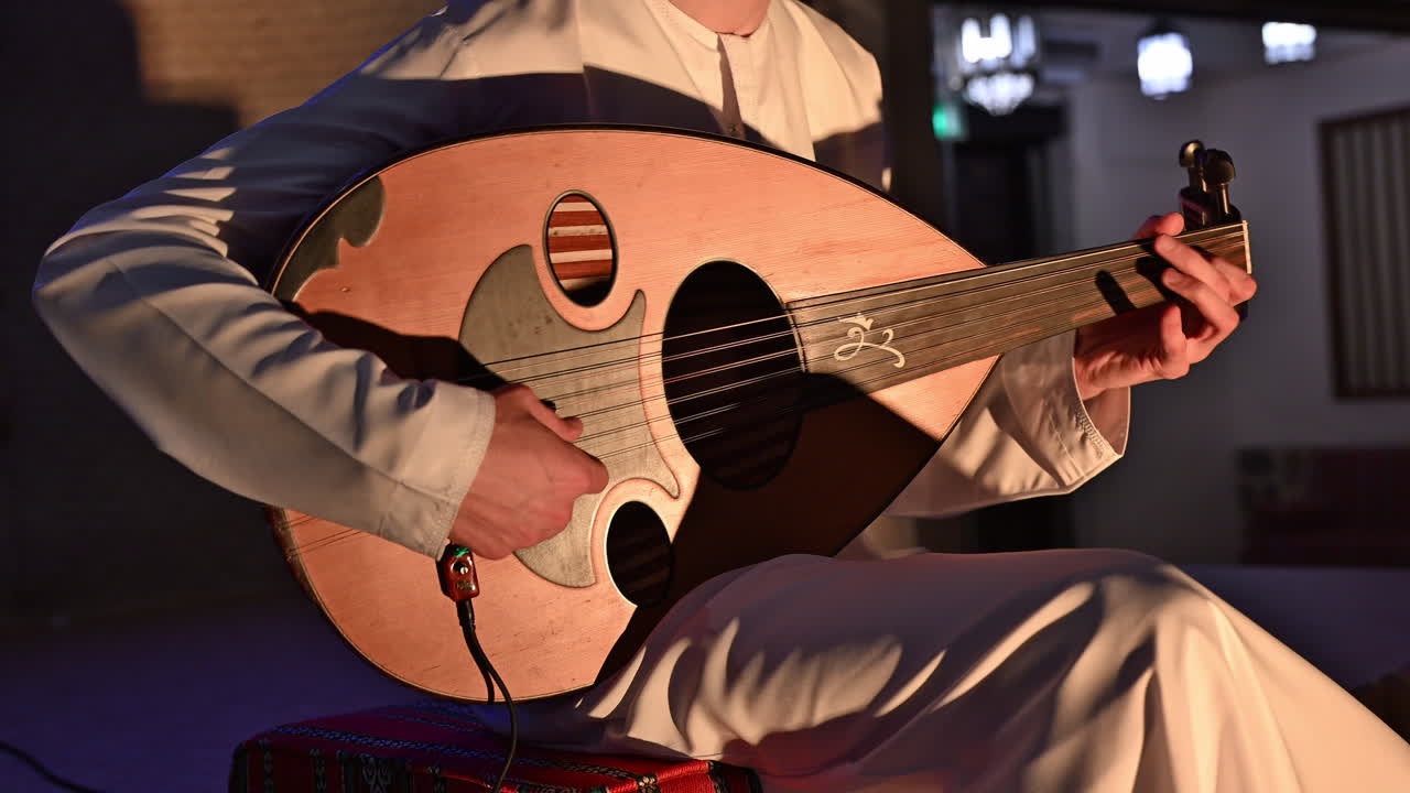An Arab musician plays the oud, a beloved traditional string instrument in Arabic music