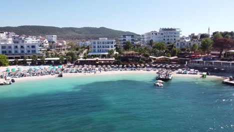 Ksamil-Beach,-Albania---Reversing-Aerial-of-Popular-Holiday-Destination