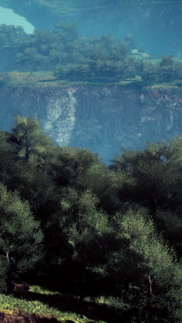 serene forest landscape with river and cliffs