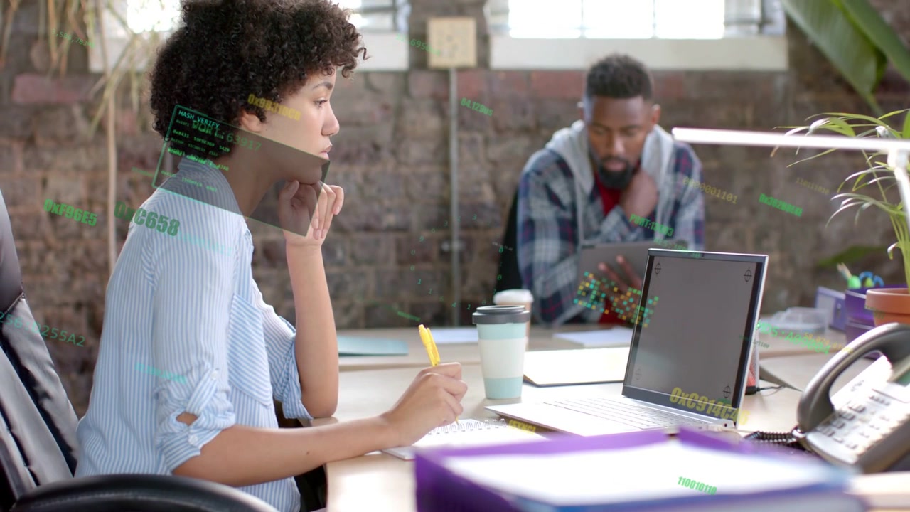 Woman taking notes checking laptop and causing green overlay for business as man tapping tablet