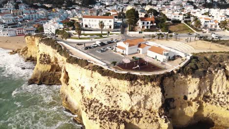 aerial 4k drone footage revealing the coastline resort city of carvoeiro, portugal