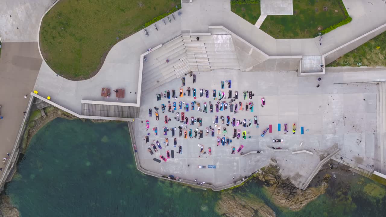 4K cinematic drone footage of a large outdoor yoga class in Dún Laoghaire, Ireland_06